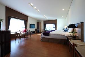Postel nebo postele na pokoji v ubytování 雲起軒民宿 Cloudscape B&B