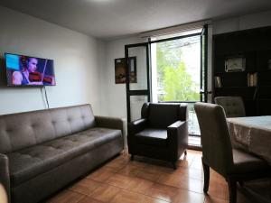 Χώρος καθιστικού στο Comfortable Suite -San Blas near Basilica of Quito