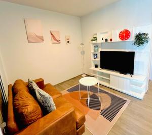 a living room with a couch and a flat screen tv at "Life city 1" Apartment 300 meters from BTS in Bang Chak +27 photos