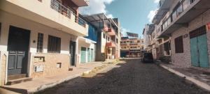 an alley with a car parked in the middle at Tarrafal snuggle in Tarrafal