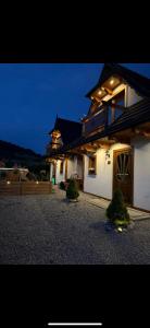 a large house with a gate in front of it at Domki na Stoku in Czarna Góra