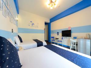 Postel nebo postele na pokoji v ubytování 花蓮市近火車站-綠宿民宿