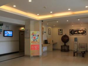 a lobby with a sign in the middle of a building at Jinjiang Inn Shanghai Baoshan Shengqiao in Luodian +57 photos