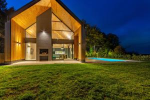 a house with a view of a yard at Blacksmith house - SPA, Heated outdoor pool, Kids zone in Varaždinske Toplice