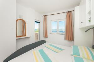 Postel nebo postele na pokoji v ubytování Apartmani Vesna