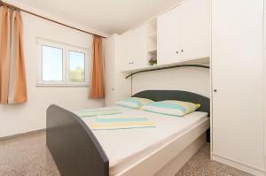 Postel nebo postele na pokoji v ubytování Apartmani Vesna