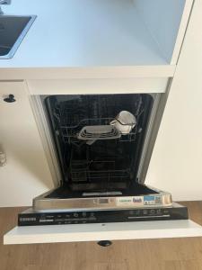 a dvd player is inside of a drawer at Studio Merendree kerk in Deinze