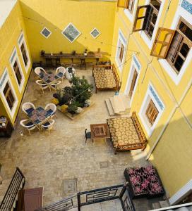 an overhead view of a patio with tables and chairs at MUSLIMA HOTEL Boutique in Bukhara