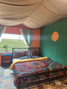 Postel nebo postele na pokoji v ubytování Cà's Garden