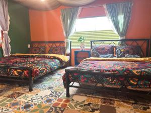 Postel nebo postele na pokoji v ubytování Cà's Garden