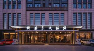 a building with a sign that reads san francisco center at Dandong Xin An Dong Hotel in Dandong