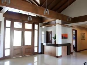 an office lobby with a door and a counter at Country Chateau Hotel in Kaybagal +77 photos