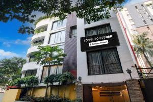 a building with a sign that reads townhouse bank at Townhouse Oak Ballygunge Formerly Hotel Lovelock in Ballygunge
