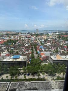 an aerial view of a city with buildings at Luxury 2BR Sea View by Superstay in Batam Center
