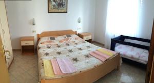 Postel nebo postele na pokoji v ubytování Apartments Bodi