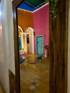 a room with colorful walls and a table and chairs at La Casa De Don Rámon in Guadalajara +74 photos