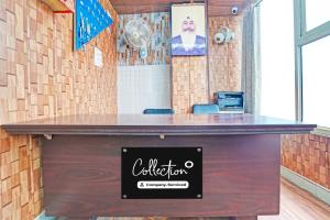 a bar in a restaurant with a sign on it at Collection O Prabhat Nagar Bareilly in Bareilly