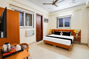 Postel nebo postele na pokoji v ubytování Super Townhouse Sector 121 Noida + 27 fotografií