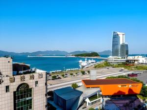 a view of a city and a body of water at HS Tourist Hotel in Shōho