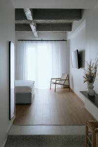 Ένα ή περισσότερα κρεβάτια σε δωμάτιο στο The Urban Living