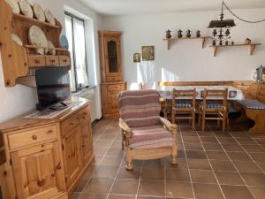 a kitchen with a table and a dining room at 031 Trilocale piano terra, Giustino in Giustino