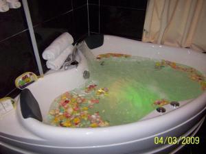 a bath tub filled with lots of candy at Paragon City Hotel in Kampong Simee +80 photos
