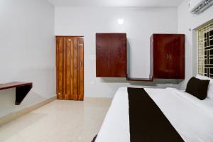 Ένα ή περισσότερα κρεβάτια σε δωμάτιο στο Hotel O Ayesha Palace +21 φωτογραφίες