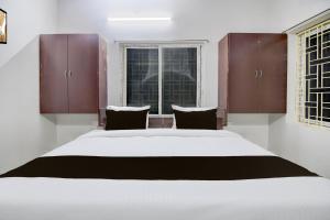 Ένα ή περισσότερα κρεβάτια σε δωμάτιο στο Hotel O Ayesha Palace