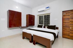 Ένα ή περισσότερα κρεβάτια σε δωμάτιο στο Hotel O Ayesha Palace