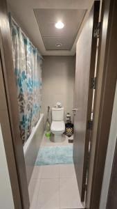 a bathroom with a white toilet in a room at Sea-View 1BR in Saadiyat - Pool - GYM - Free Parking in Abu Dhabi