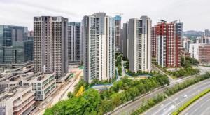 an aerial view of a city with tall buildings at Yanlord Dream Park Hotel Apartment in Longgang