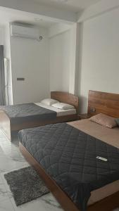 Postel nebo postele na pokoji v ubytování Green inn Trinco