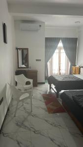 Posezení v ubytování Green inn Trinco + 1 fotografie