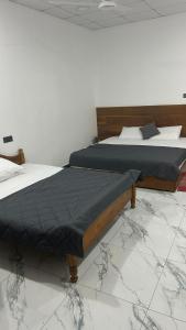 Postel nebo postele na pokoji v ubytování Green inn Trinco