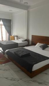 Een bed of bedden in een kamer bij Green inn Trinco +5 foto's