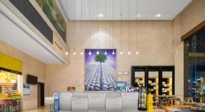 a grocery store with a large picture on the wall at Lavande Hotel Nanchang Ai Xi Hu Subway East Station Branch in Nanchang