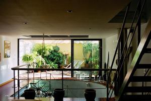 a room with a large window and a staircase at Loft de Cannes B&B in Cannes