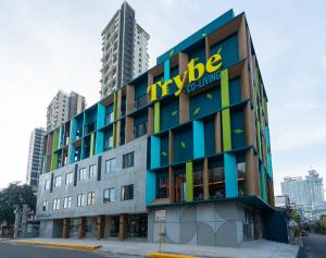 a building with a tybee island sign on it at Trybe CoLiving in Cebu City