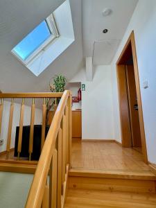 a staircase with a skylight in a house at Sabes Ferienwohnung in Altglandorf