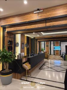 a lobby of a building with a reception desk at سوات للشقق المخدومة 5 in Al Khobar