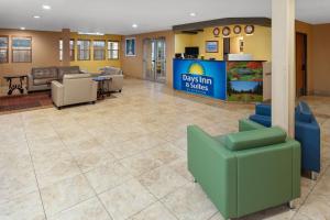 a lobby with aubs in parties sign and a waiting room at Days Inn & Suites by Wyndham Spokane Airport Airway Heights in Airway Heights