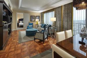 a living room with a kitchen and a dining room at Hyatt Regency Tulsa Downtown in Tulsa
