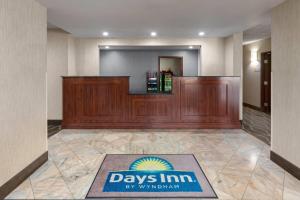 a lobby with a sign that says days inn by wolverhampton at Days Inn by Wyndham Blairsville in Blairsville