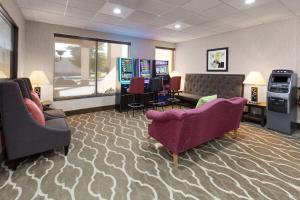 a waiting room with couches and a video game at Days Inn by Wyndham Blairsville in Blairsville