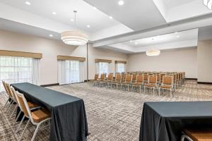 a conference room with a black table and chairs at La Quinta by Wyndham Boone in Boone +62 photos