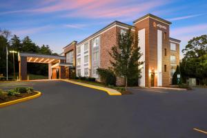 an empty parking lot in front of a building at La Quinta by Wyndham Sturbridge in Sturbridge