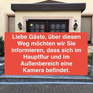 a sign in front of a house at Palminas Monteur FeWo EG in Merzig