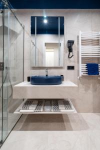 a bathroom with a sink and a mirror at Art Hotel in Chişinău