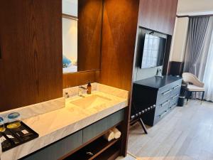 a bathroom with a sink and a large mirror at Liban Hotel in Xi'an