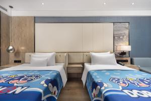 Postel nebo postele na pokoji v ubytování Chengdu Lichengyi Hotel Chunxi Road Tianfu Square Branch + 42 fotografií